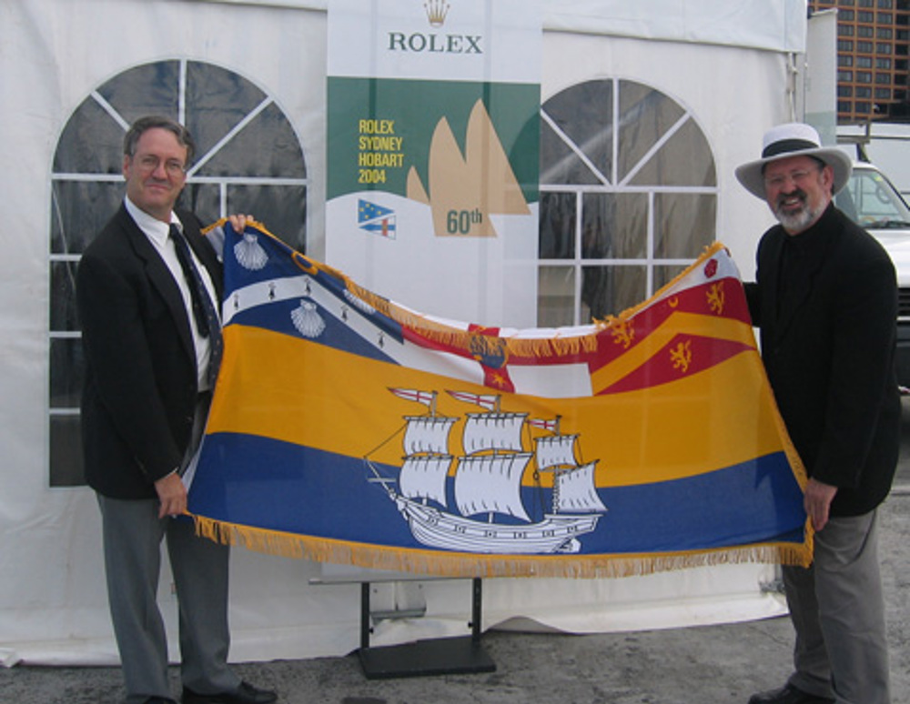 Commodore James presents Alderman Valentine, Lord Mayor of Hobart, with a City of Sydney Flag